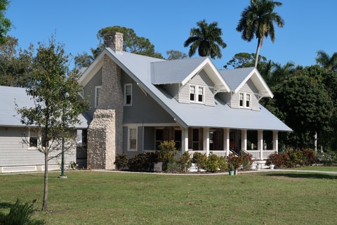 two story house with stone fire chimney